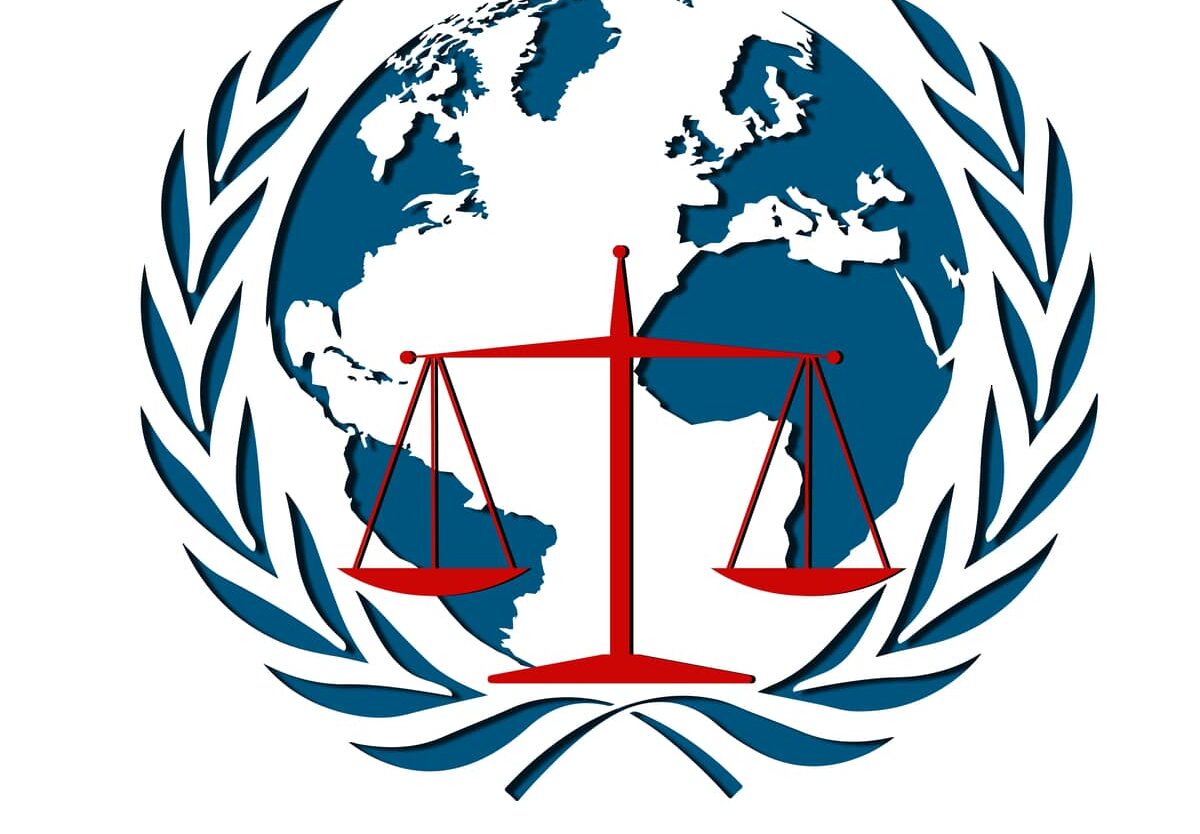 Global emblem with scales of justice representing international legal reach